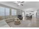 Bright dining room with wooden table, six chairs, and kitchen view at 2346 S Banning St, Gilbert, AZ 85295