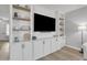 Built-in white entertainment center with ample shelving and storage at 2346 S Banning St, Gilbert, AZ 85295