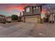 Two-story house with attached garage and a welcoming front porch at 2346 S Banning St, Gilbert, AZ 85295