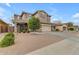 Two-story house with beige exterior, two-car garage, and landscaping at 2346 S Banning St, Gilbert, AZ 85295