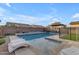 Inviting backyard pool with pergola and artificial turf at 2346 S Banning St, Gilbert, AZ 85295