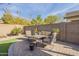 Landscaped backyard with seating area and plants at 2414 W Gambit Trl, Phoenix, AZ 85085