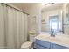 Clean bathroom with vanity, shower, and toilet at 2414 W Gambit Trl, Phoenix, AZ 85085