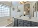 Bathroom with double vanity and soaking tub at 2414 W Gambit Trl, Phoenix, AZ 85085