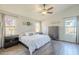 Main bedroom with wood-look floors and plenty of natural light at 2414 W Gambit Trl, Phoenix, AZ 85085