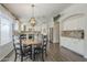 Dining area features a round table and four chairs near the kitchen at 2414 W Gambit Trl, Phoenix, AZ 85085