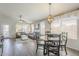 Dining area features a round wooden table and four chairs at 2414 W Gambit Trl, Phoenix, AZ 85085