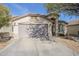 Single-story home with attached garage and desert landscaping at 2414 W Gambit Trl, Phoenix, AZ 85085