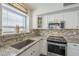 Kitchen features granite countertops and white cabinetry at 2414 W Gambit Trl, Phoenix, AZ 85085