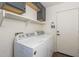 Laundry room with washer, dryer, and cabinets at 2414 W Gambit Trl, Phoenix, AZ 85085