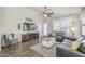 Cozy living room featuring wood-look floors and a fireplace at 2414 W Gambit Trl, Phoenix, AZ 85085