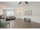 Living room with wood-look floors and shiplap accent wall at 2414 W Gambit Trl, Phoenix, AZ 85085