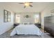 Main bedroom with wood-look floors and ceiling fan at 2414 W Gambit Trl, Phoenix, AZ 85085