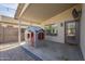 Covered patio with playhouse and brick pavers at 2414 W Gambit Trl, Phoenix, AZ 85085