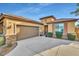 One-story house with a two-car garage and nicely landscaped front yard at 26119 W Wahalla Ln, Buckeye, AZ 85396