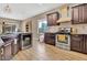 Modern kitchen with stainless steel appliances and a light-colored backsplash at 26119 W Wahalla Ln, Buckeye, AZ 85396