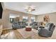 Relaxing living room with comfortable seating and tile flooring at 26119 W Wahalla Ln, Buckeye, AZ 85396