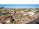 Aerial view of a suburban neighborhood with a single-Gathering home at 26602 S Nicklaus Dr, Sun Lakes, AZ 85248