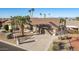 Single-story home with a two-car garage and desert landscaping at 26602 S Nicklaus Dr, Sun Lakes, AZ 85248