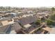 Aerial view highlighting home's backyard, featuring a covered patio and spacious yard at 26602 S Nicklaus Dr, Sun Lakes, AZ 85248