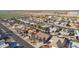 Aerial view of a home situated in a neighborhood with surrounding desert landscape at 26602 S Nicklaus Dr, Sun Lakes, AZ 85248