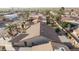 Aerial view of home's backyard, showcasing a patio and desert landscaping at 26602 S Nicklaus Dr, Sun Lakes, AZ 85248