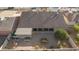 Aerial view of the home's backyard, including patio, landscaping, and seating area at 26602 S Nicklaus Dr, Sun Lakes, AZ 85248