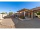 Backyard with patio, pergola, putting green, and seating area at 26602 S Nicklaus Dr, Sun Lakes, AZ 85248