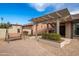 Relaxing backyard patio with pergola, seating area, and brick paving at 26602 S Nicklaus Dr, Sun Lakes, AZ 85248