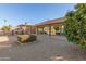 Backyard with gravel, landscaping, and a view of the home at 26602 S Nicklaus Dr, Sun Lakes, AZ 85248