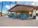 Community pool area with covered seating and tables at 26602 S Nicklaus Dr, Sun Lakes, AZ 85248