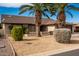 Single-story home with attractive landscaping at 26602 S Nicklaus Dr, Sun Lakes, AZ 85248