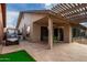 Outdoor patio space with seating, pergola, and golf cart at 26602 S Nicklaus Dr, Sun Lakes, AZ 85248