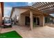 Spacious patio with seating area and golf cart at 26602 S Nicklaus Dr, Sun Lakes, AZ 85248