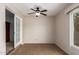 Bright sunroom with tile flooring and French doors at 26602 S Nicklaus Dr, Sun Lakes, AZ 85248