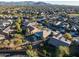 Aerial view of a house and neighborhood with desert landscape at 27060 W Ross Ave, Buckeye, AZ 85396