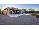 Backyard view showcasing patio and desert landscaping at 27060 W Ross Ave, Buckeye, AZ 85396