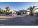 Landscaped backyard with gravel and covered patio at 27060 W Ross Ave, Buckeye, AZ 85396