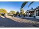 Relaxing backyard with patio, seating, and desert plants at 27060 W Ross Ave, Buckeye, AZ 85396