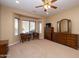 Main bedroom with bay window and dresser at 27060 W Ross Ave, Buckeye, AZ 85396