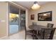 Bright breakfast nook with table and chairs near sliding glass door at 27060 W Ross Ave, Buckeye, AZ 85396