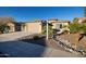 Single-story home with desert landscaping and a two-car garage at 27060 W Ross Ave, Buckeye, AZ 85396