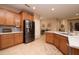 Modern kitchen with stainless steel appliances and breakfast bar at 27060 W Ross Ave, Buckeye, AZ 85396