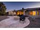 Covered patio with fire pit and seating area at 27060 W Ross Ave, Buckeye, AZ 85396