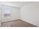 Bedroom with neutral carpet, window, and neutral paint at 2707 S 357Th Dr, Tonopah, AZ 85354