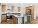 Kitchen boasts stainless appliances, a center island, and lots of wood cabinets at 2707 S 357Th Dr, Tonopah, AZ 85354