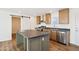 Kitchen with stainless steel appliances, ample cabinet space, and center island at 2707 S 357Th Dr, Tonopah, AZ 85354