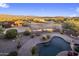 Aerial view showing expansive property with pool, barn, and desert landscape at 27627 N 168Th St, Rio Verde, AZ 85263