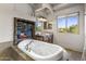 Luxurious bathroom with a large soaking tub and mountain views at 27627 N 168Th St, Rio Verde, AZ 85263