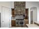 View of the kitchen's stone range hood and stainless steel appliances at 27627 N 168Th St, Rio Verde, AZ 85263